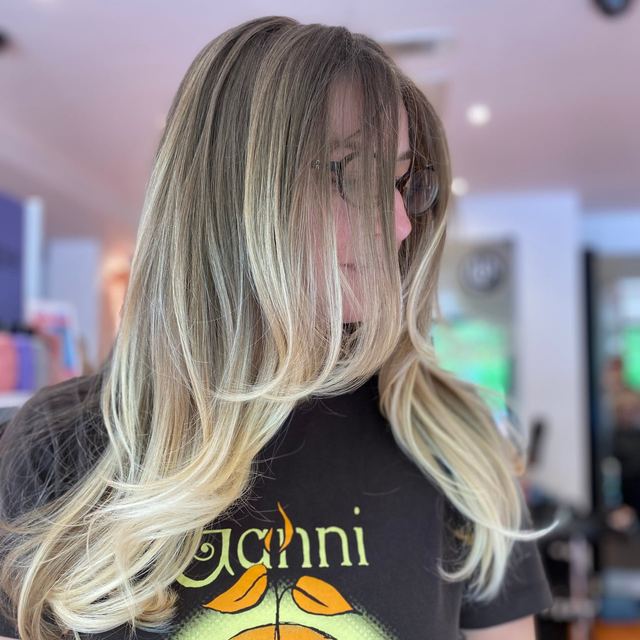 Blonde balayage with curtain fringe